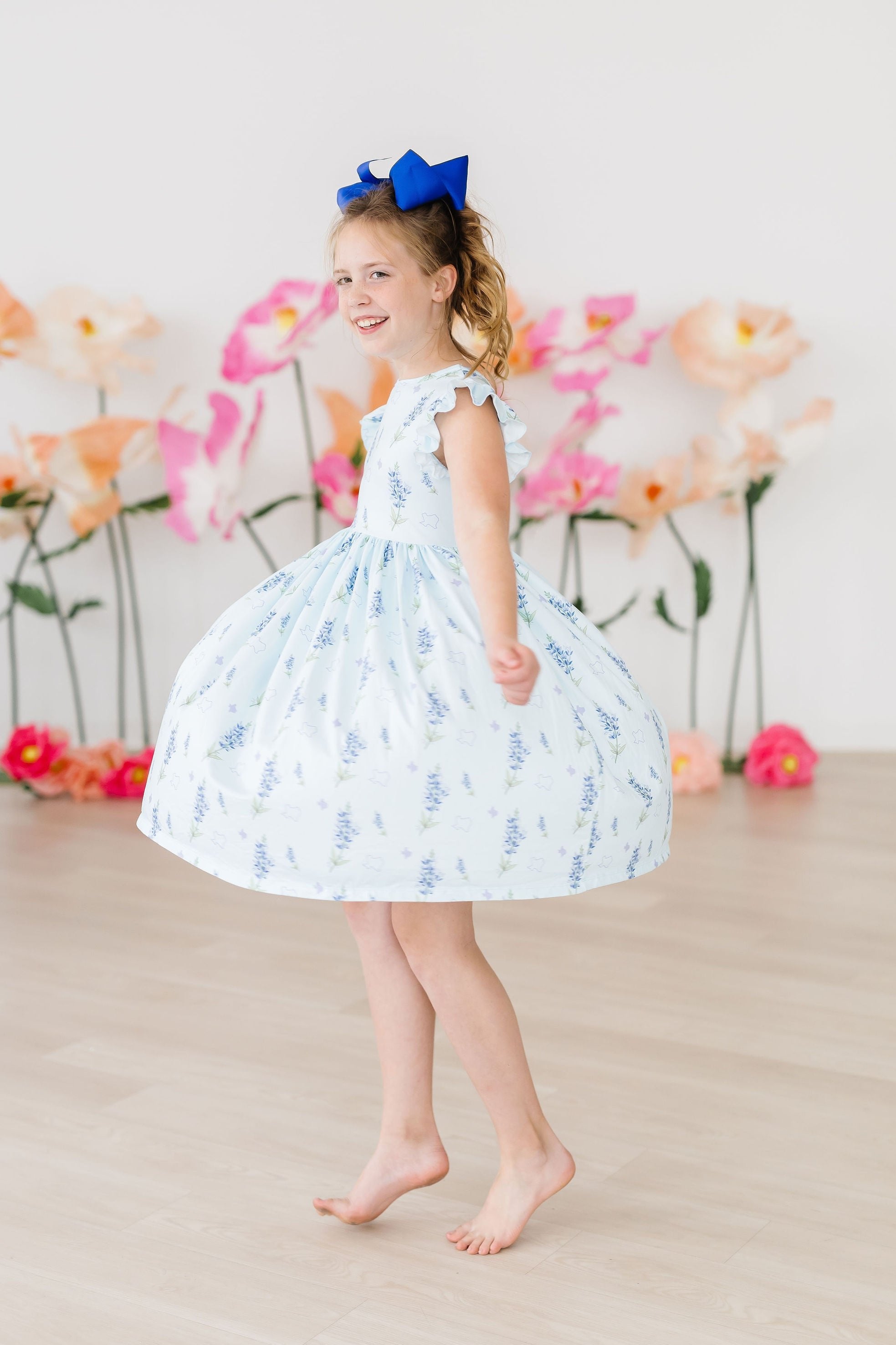 Mila & Rose ® Texas Bluebonnets Flutter Sleeve Twirl Dress — back view