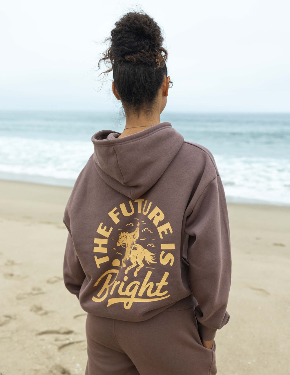 Elevated Faith The Future Is Bright Rodeo Unisex Hoodie — Elevated Faith branding close-up