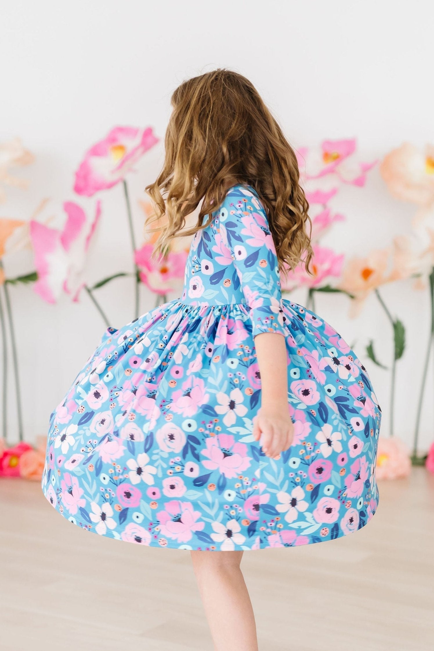 Mila & Rose ® Twirling in Teal 3/4 Sleeve Pocket Twirl Dress — side view