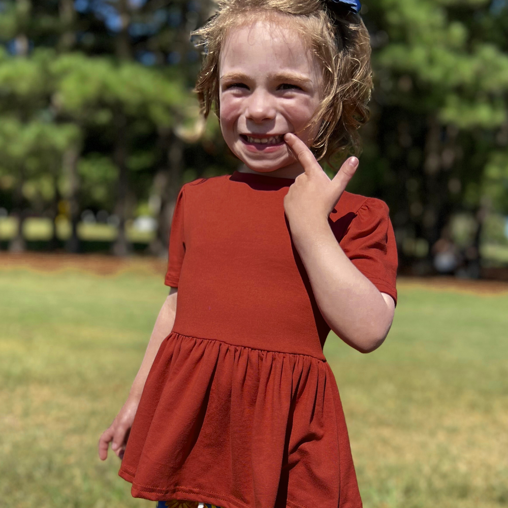 bumblitostore Bamboo Short Sleeve Peplum Top in Brick — main product shot