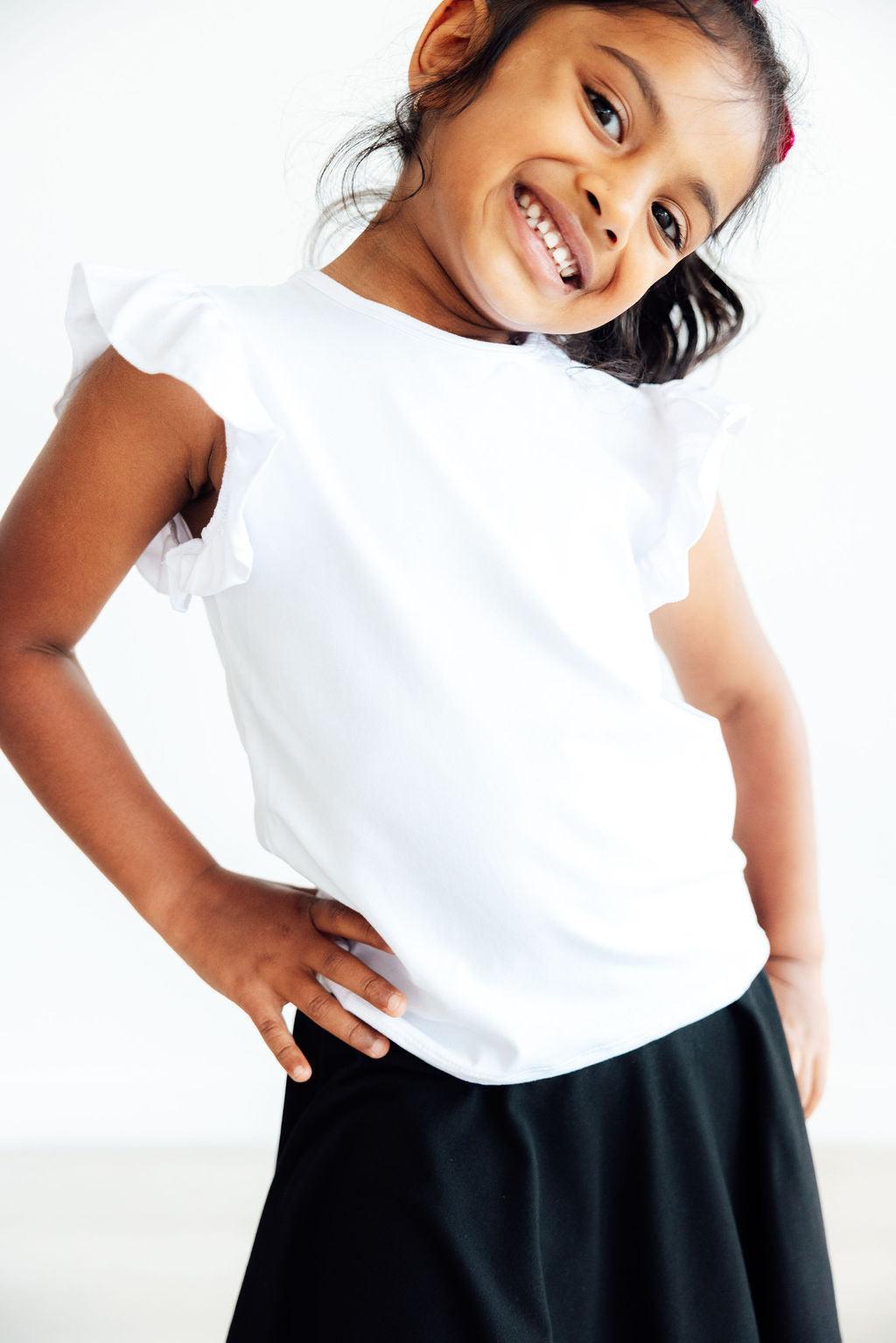 Mila & Rose ® White S/S Ruffle Tee — lifestyle context
