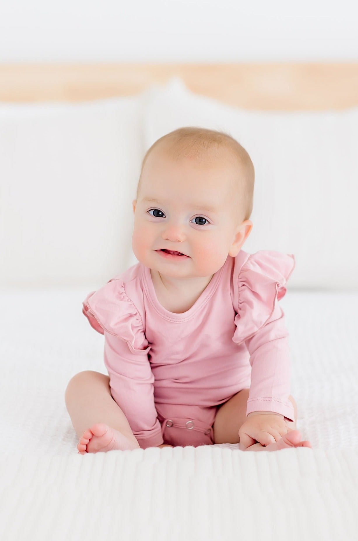 Mila & Rose ® Vintage Pink L/S Flutter Bodysuit — lifestyle context