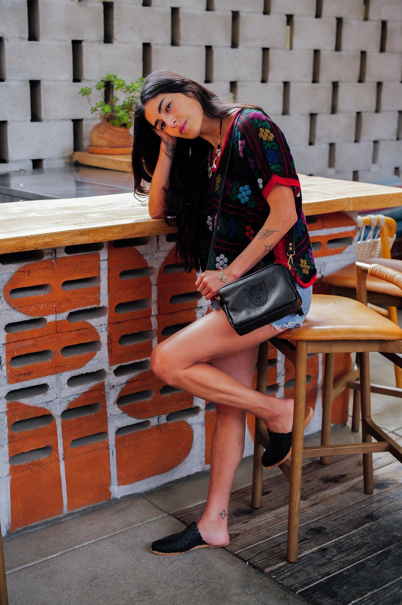 LOLA Y TULA Jaguar Lucia Crossbody Black — in-use photo