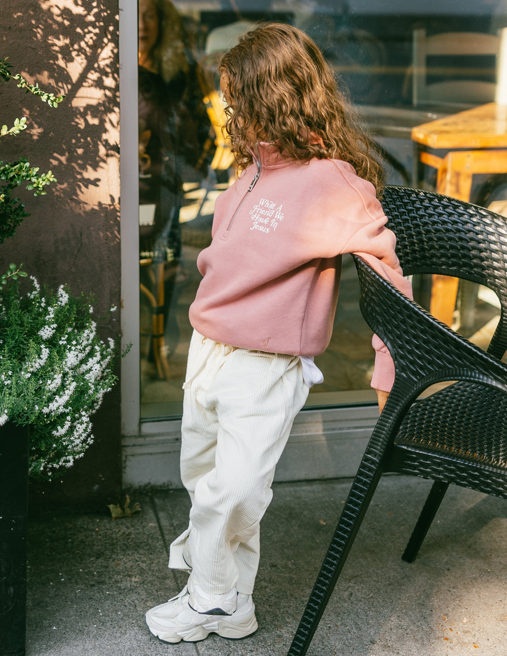 Elevated Faith What a Friend in Jesus Kids Half-Zip — Elevated Faith branding close-up