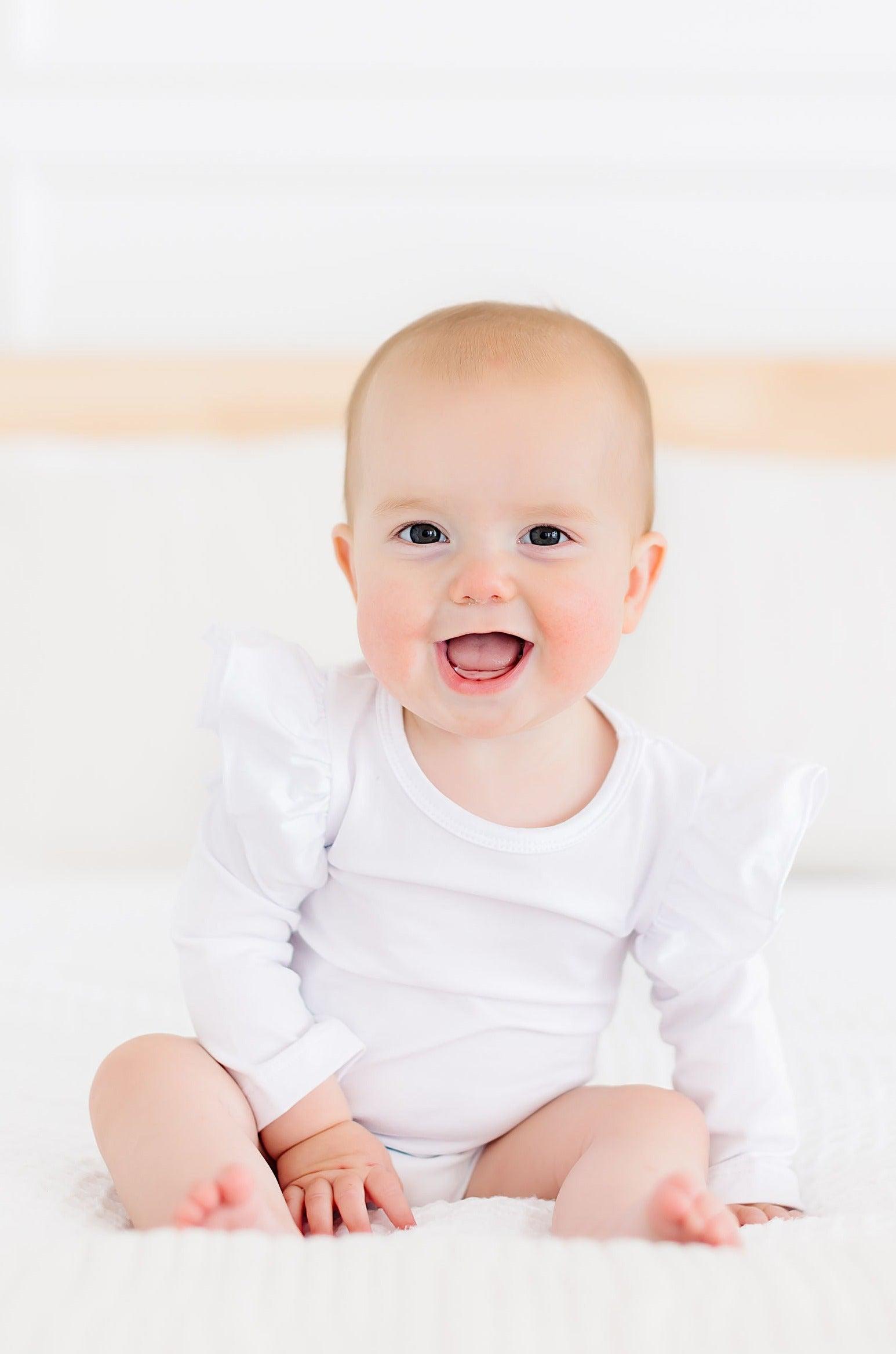 Mila & Rose ® White L/S Flutter Bodysuit — detail close-up