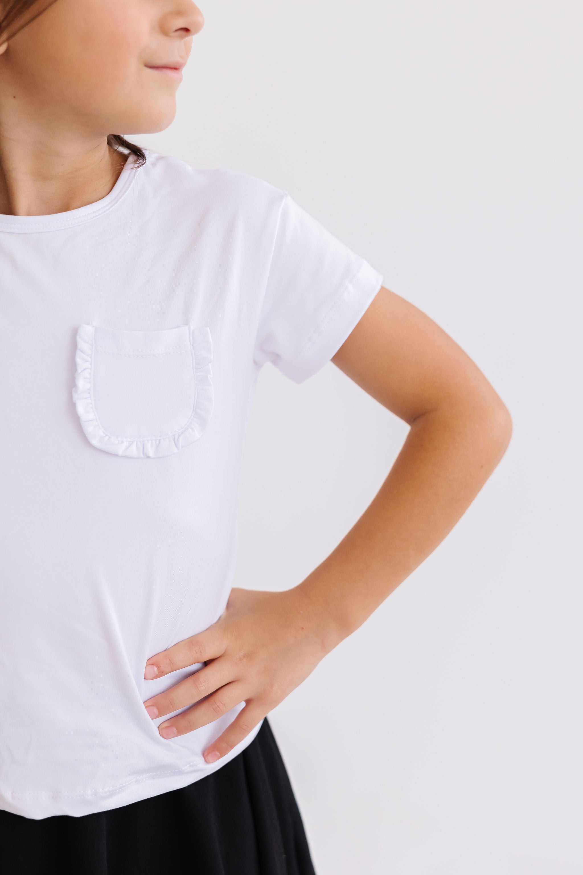 Mila & Rose ® White Ruffle Pocket Tee — lifestyle context