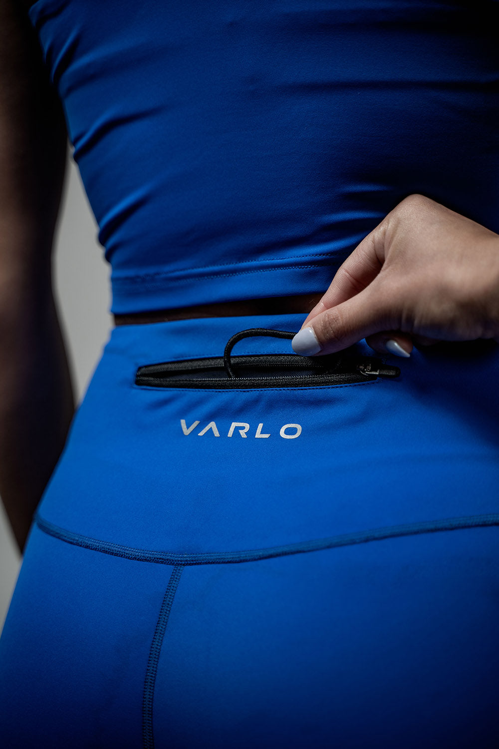 Varlo Women's SOHO  3/4 Leggings (Neo Blue) — Varlo branding close-up