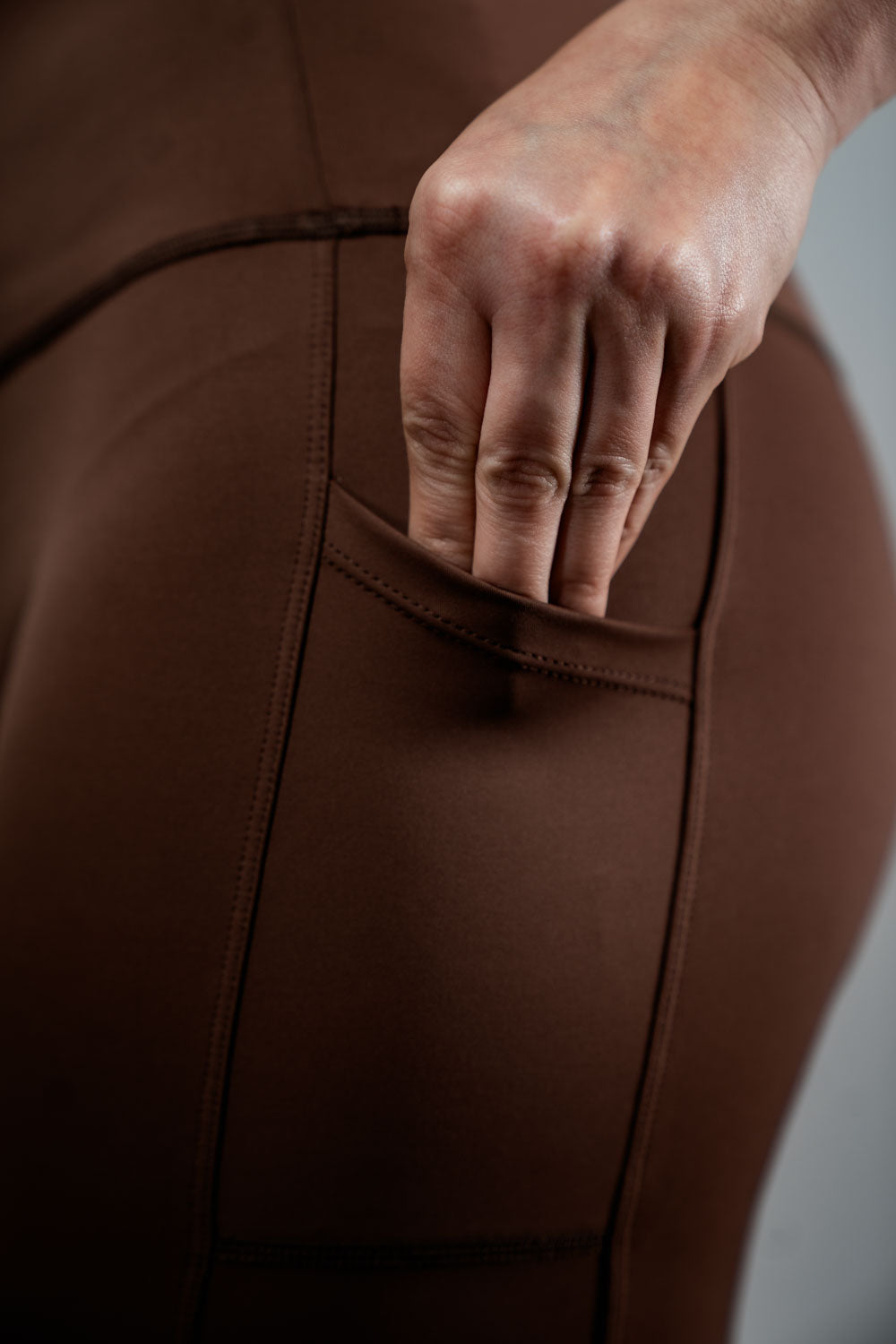 Varlo Women's SOHO Fitness Shorts 8" (City Mocha) — Varlo branding close-up