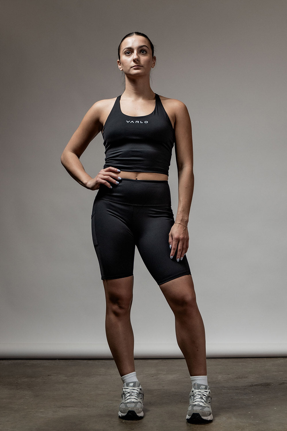 Varlo Women's SOHO Cross Back Crop Tank (Black) — lifestyle worn / used context