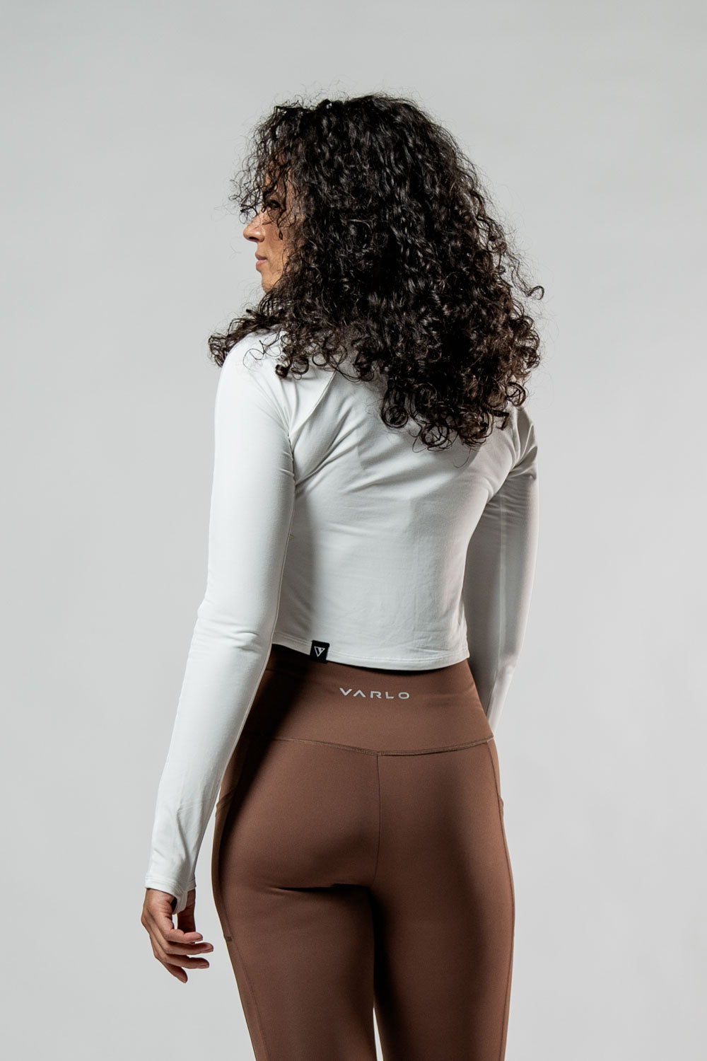 Varlo Women's Terra Recovery Arc Long Sleeve Crop (White) — flat-lay composition