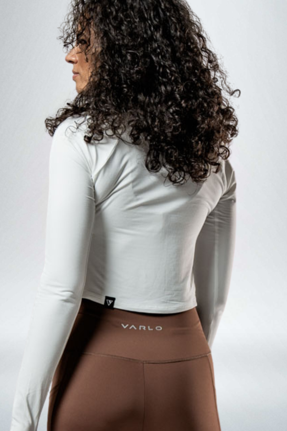 Varlo Women's Terra Recovery Arc Long Sleeve Crop (White) — Varlo branding close-up