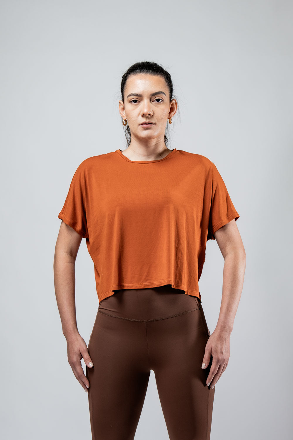 Varlo Varlo Women's Terra Recovery Drift Crop (Sunfire Clay) — flat-lay composition
