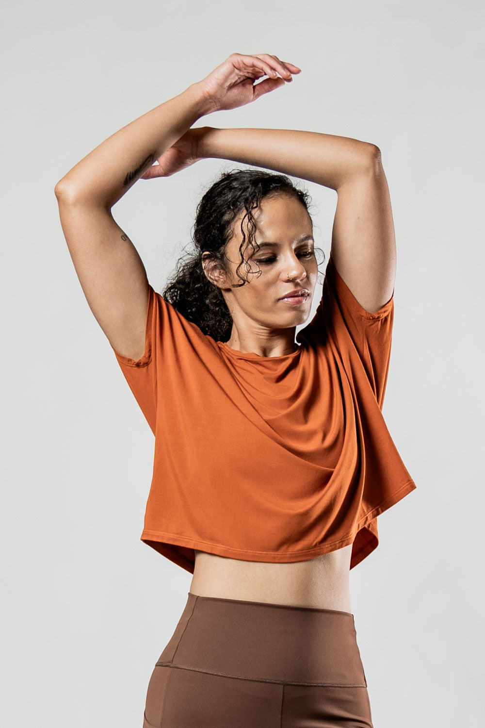 Varlo Women's Terra Recovery Drift Crop (Sunfire Clay) — Varlo branding close-up