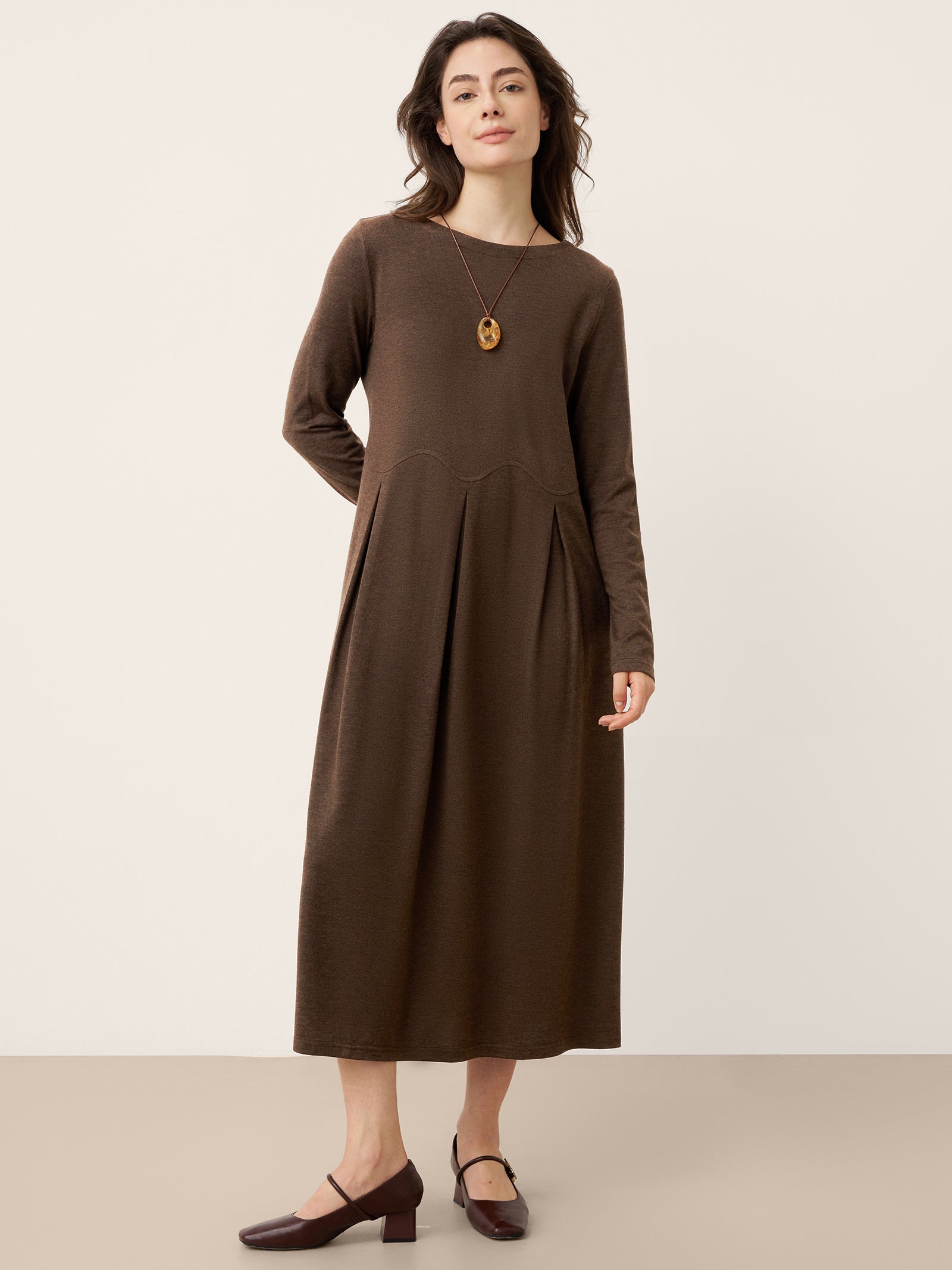 LINTICO Wool Arc-Panel Sculpted Pleats Maxi Dress CALISTA — LINTICO branding close-up