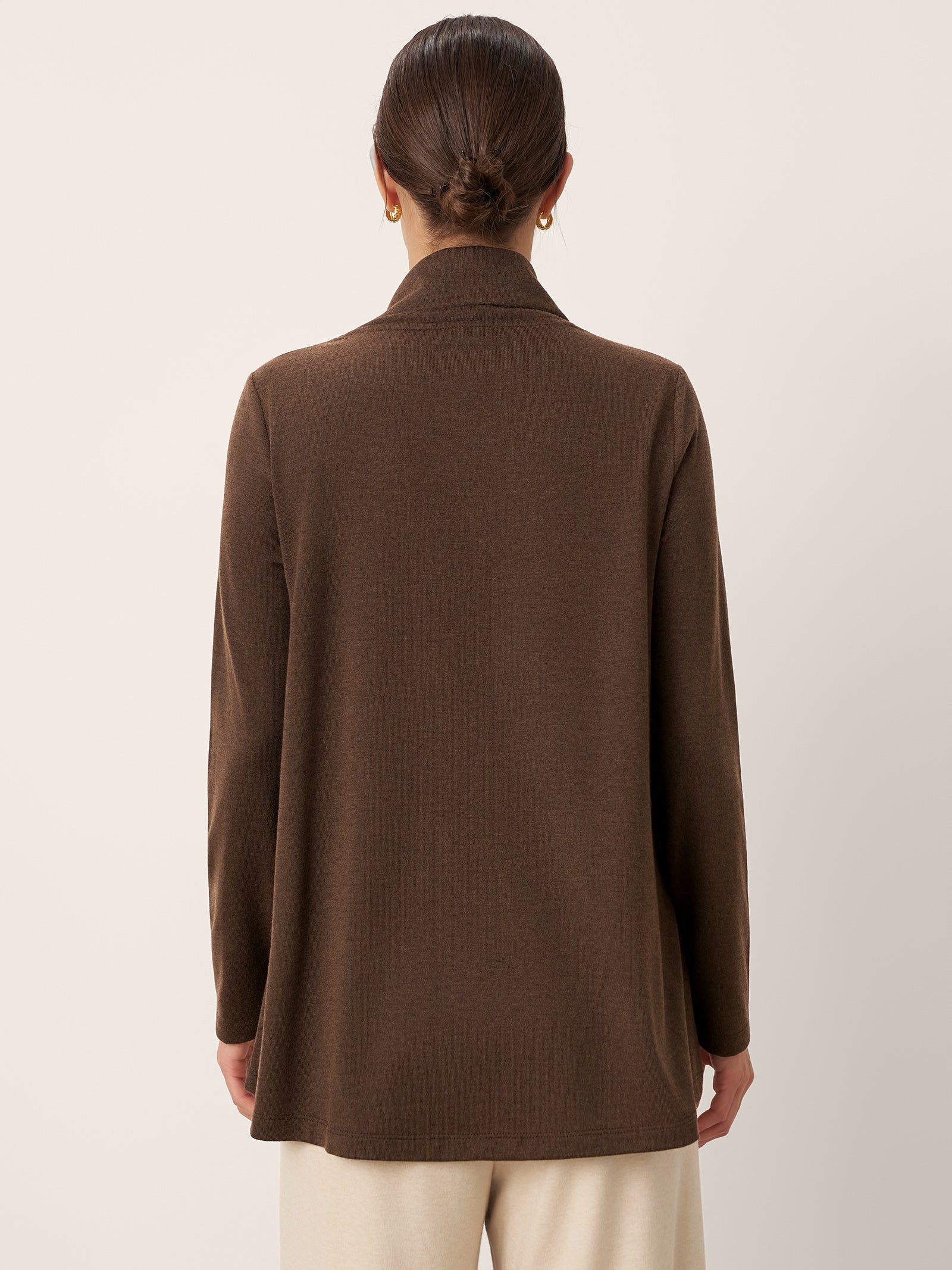 LINTICO Wool Asymmetric Hem Long Sleeve Top CHARITY — LINTICO branding close-up