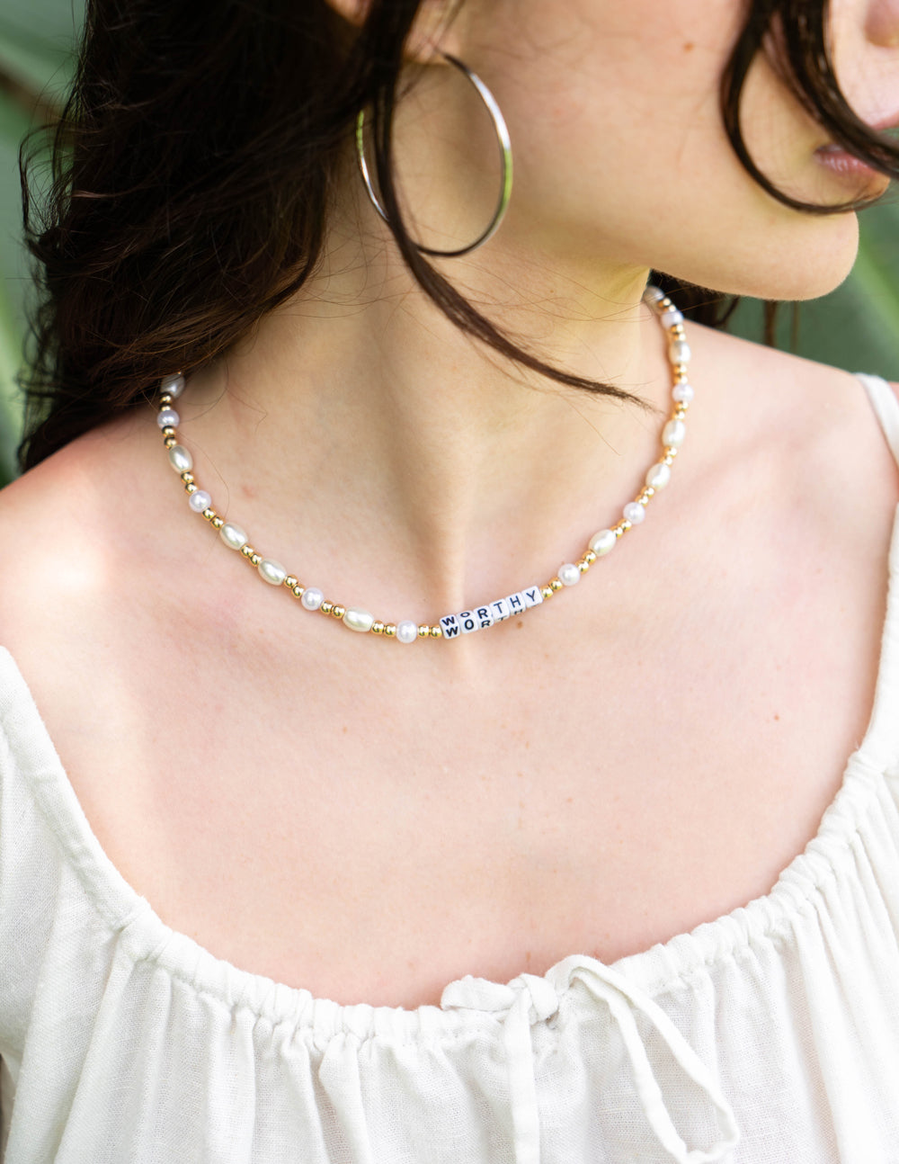 Elevated Faith Worthy Letter Necklace — detail close-up