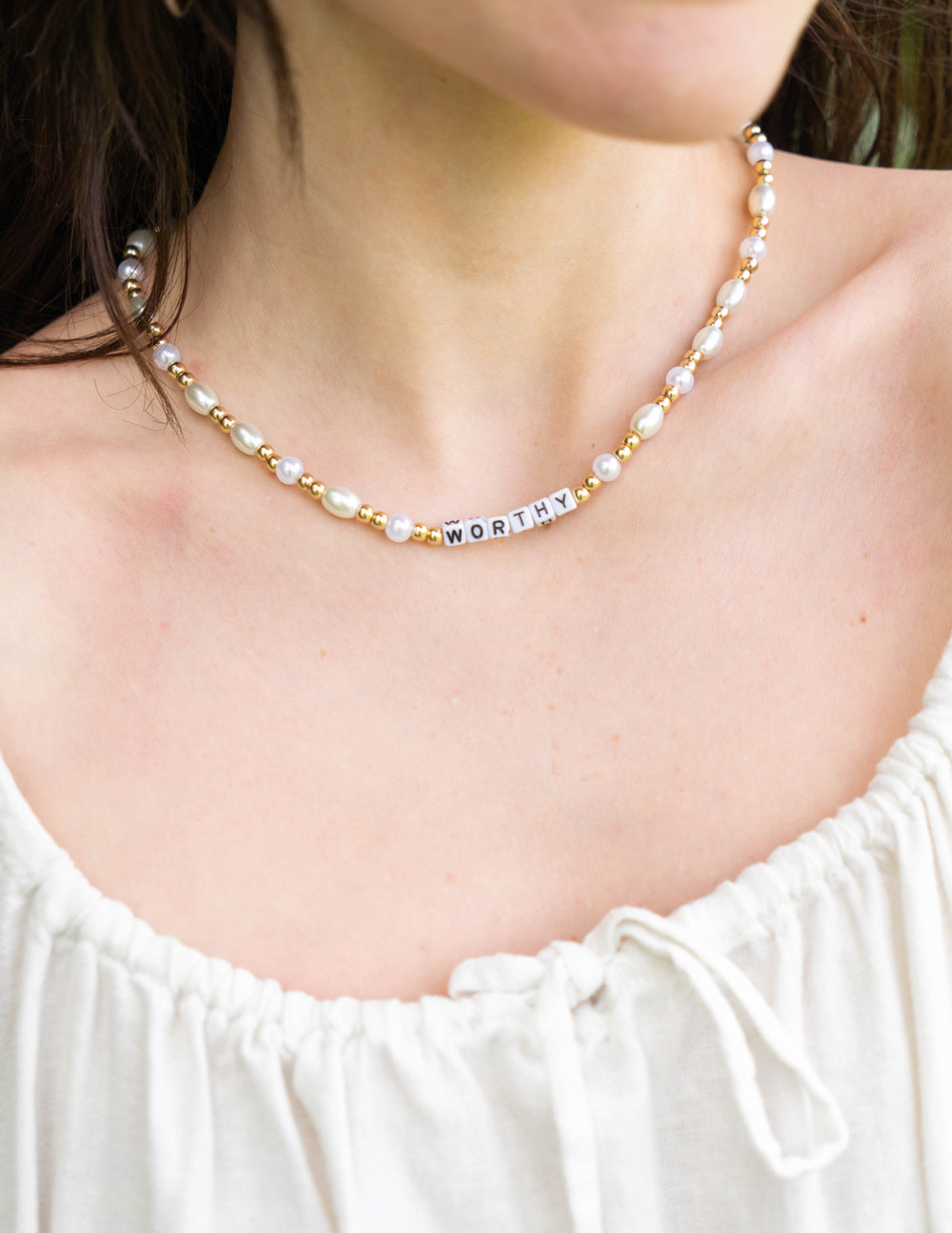 Elevated Faith Worthy Letter Necklace — lifestyle context