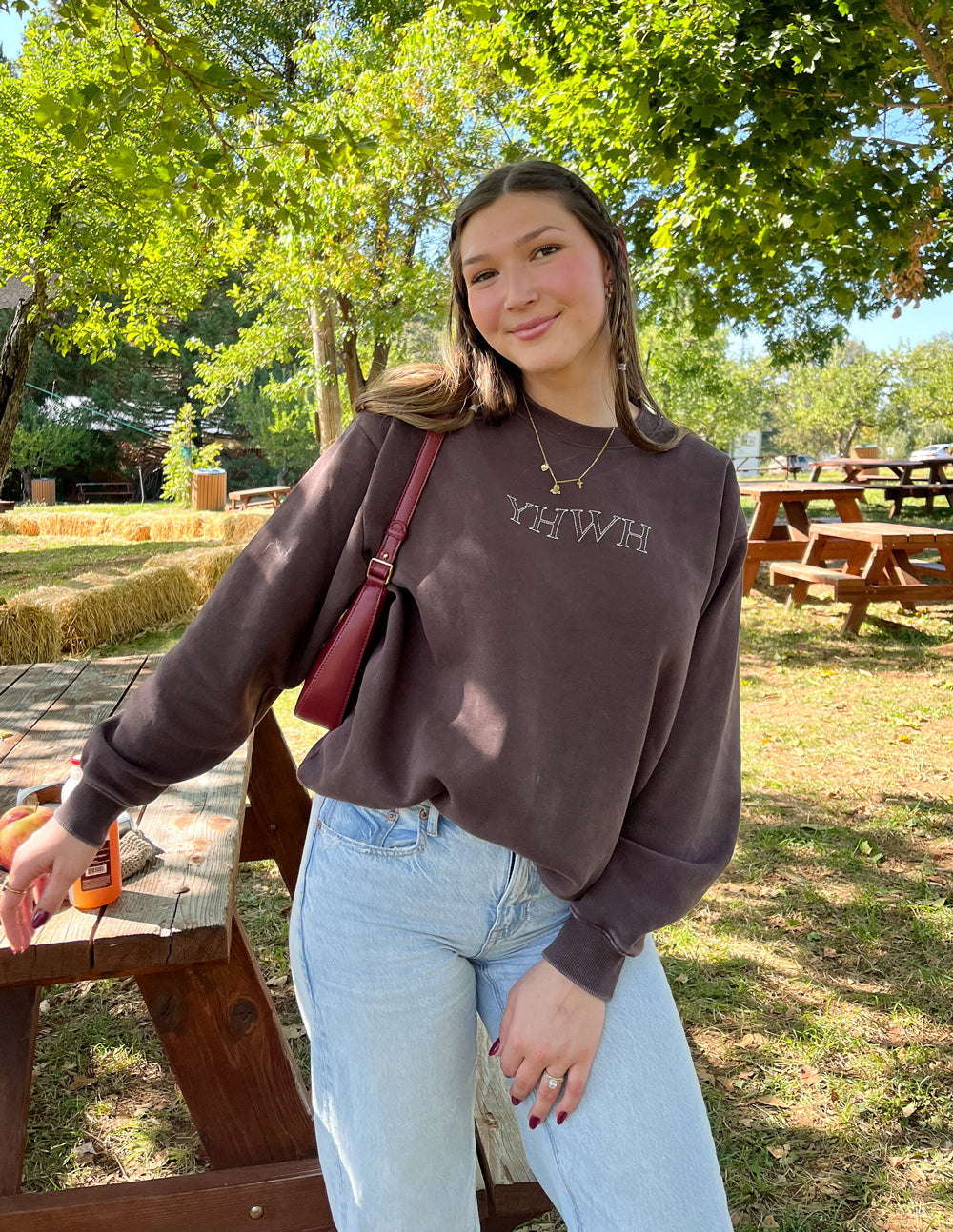 Elevated Faith YHWH Unisex Crewneck — lifestyle worn / used context