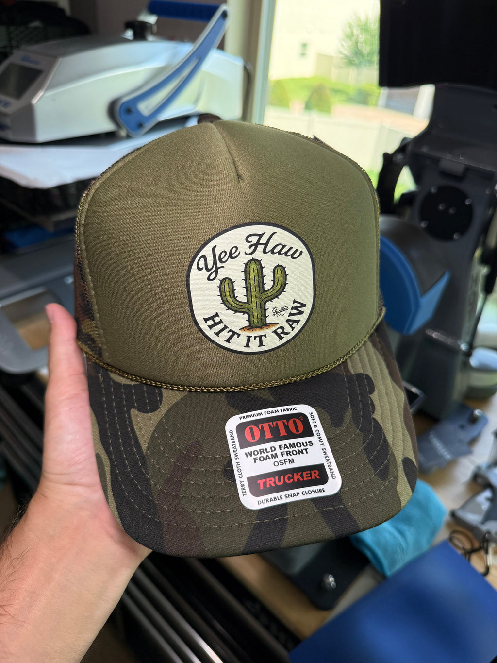 Luckless Outfitters Yee Haw Hit it Raw Camo Trucker — side view