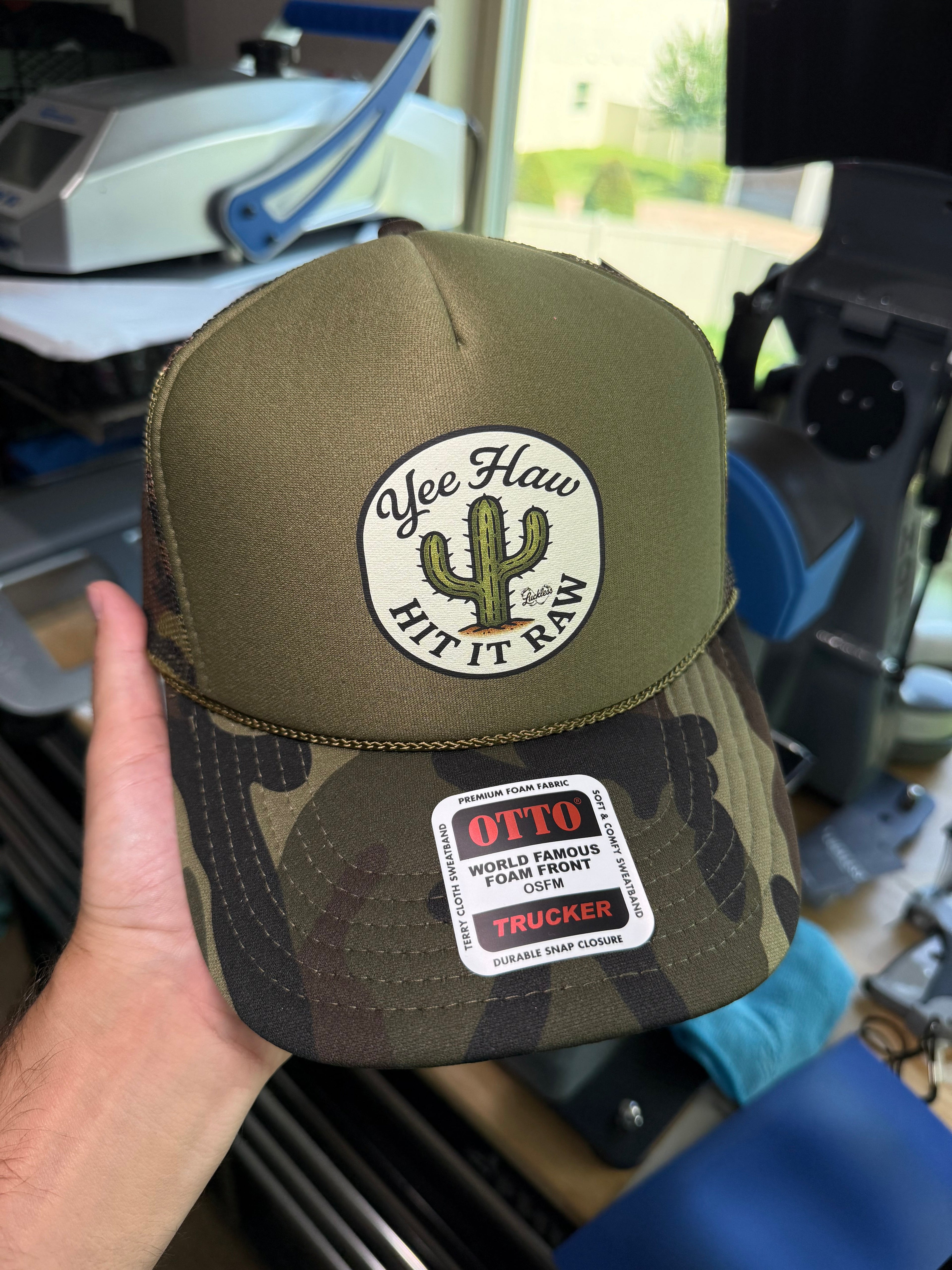 Luckless Outfitters Yee Haw Hit it Raw Camo Trucker — side view
