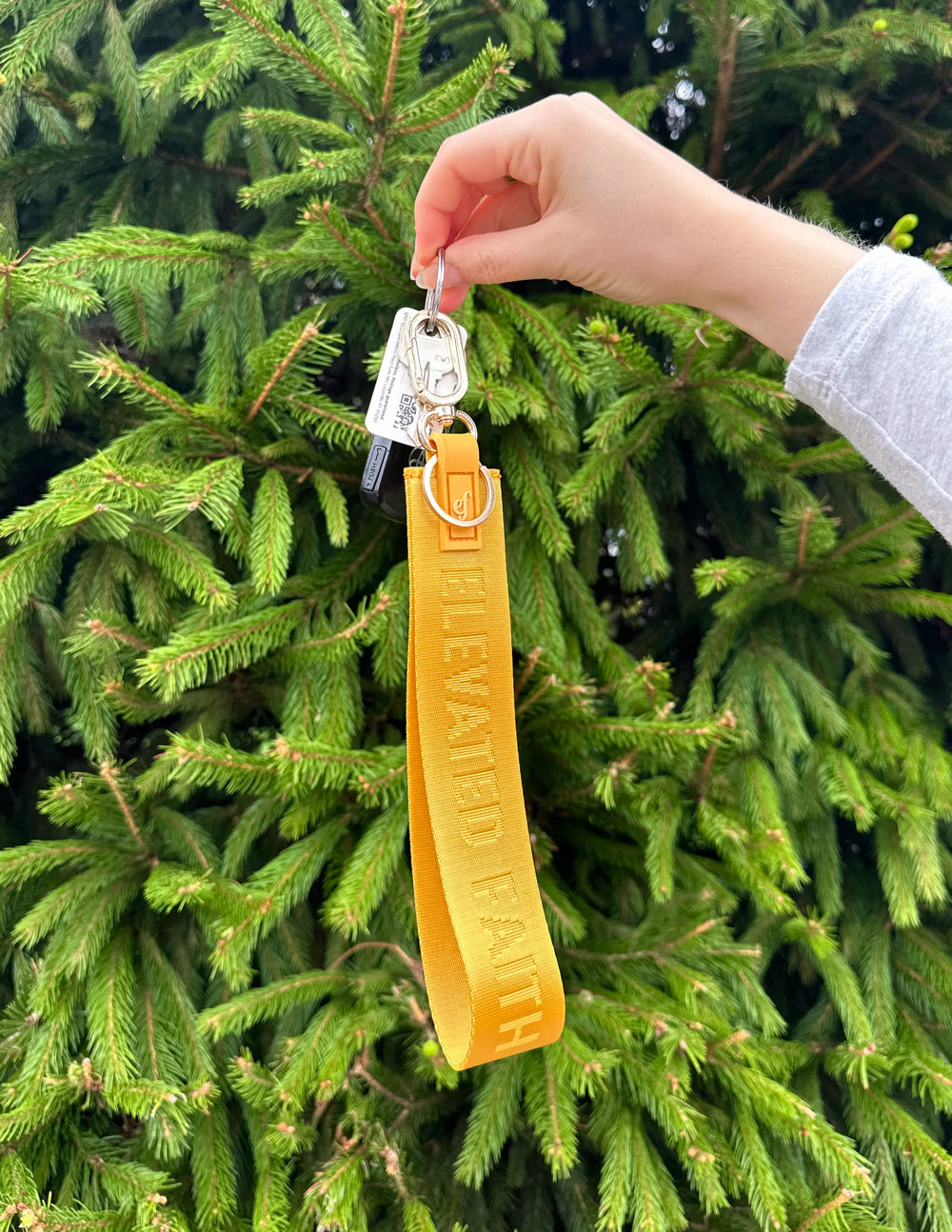Elevated Faith Yellow Oversized Logo Keychain — Elevated Faith branding close-up