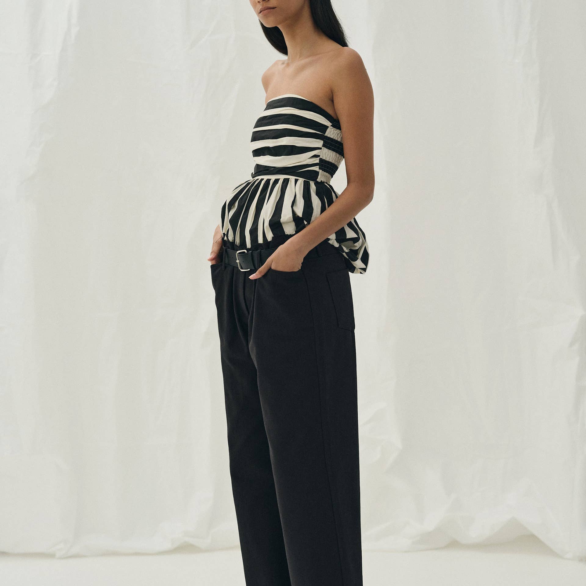 Pretty Little Patriot Pretty Little Patriot Black & White Striped Bubble Tube Top — Pretty Little Patriot branding close-up