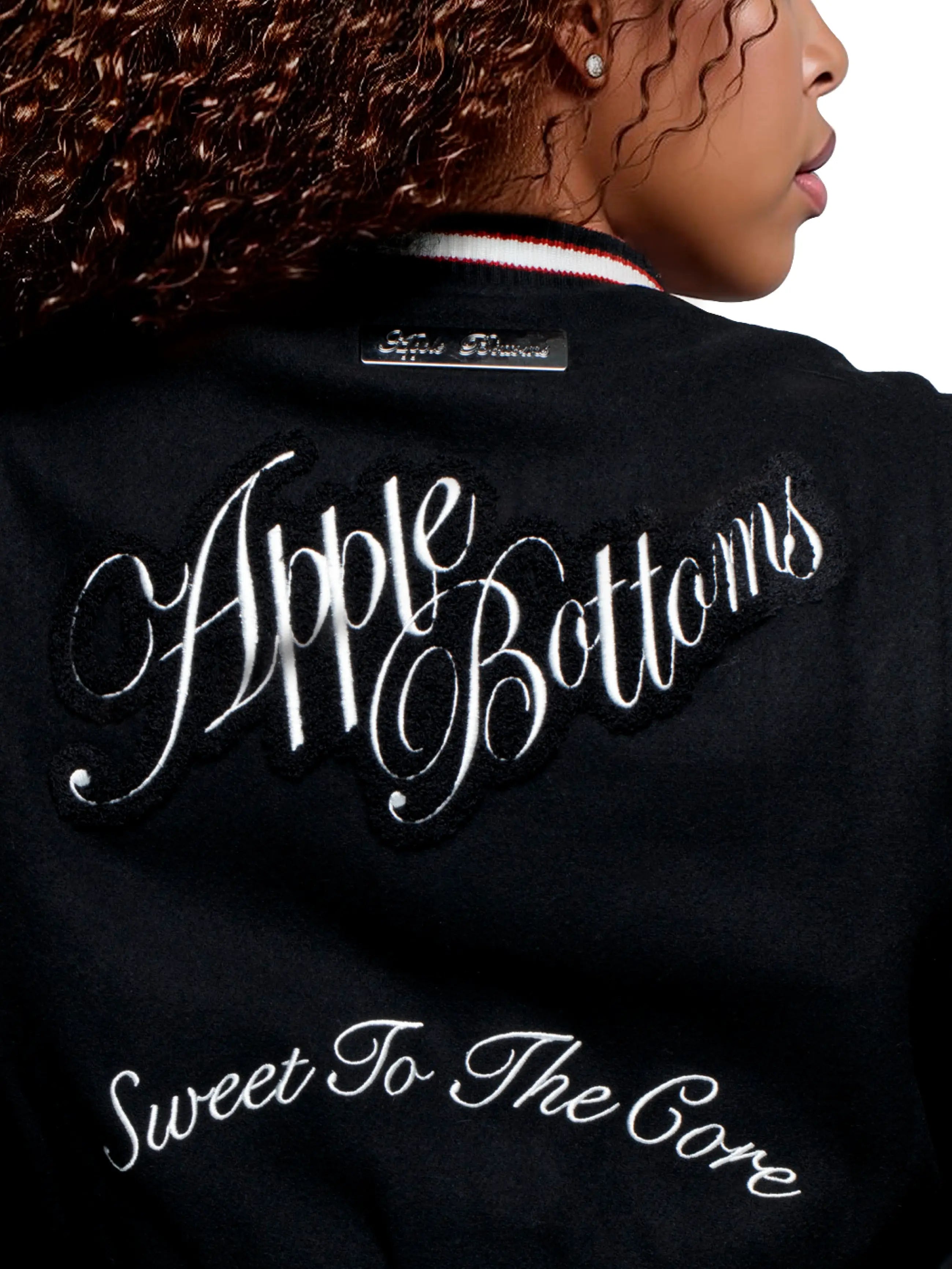 Apple Bottom Jeans Apple Varsity Jacket / Vest — branding close-up