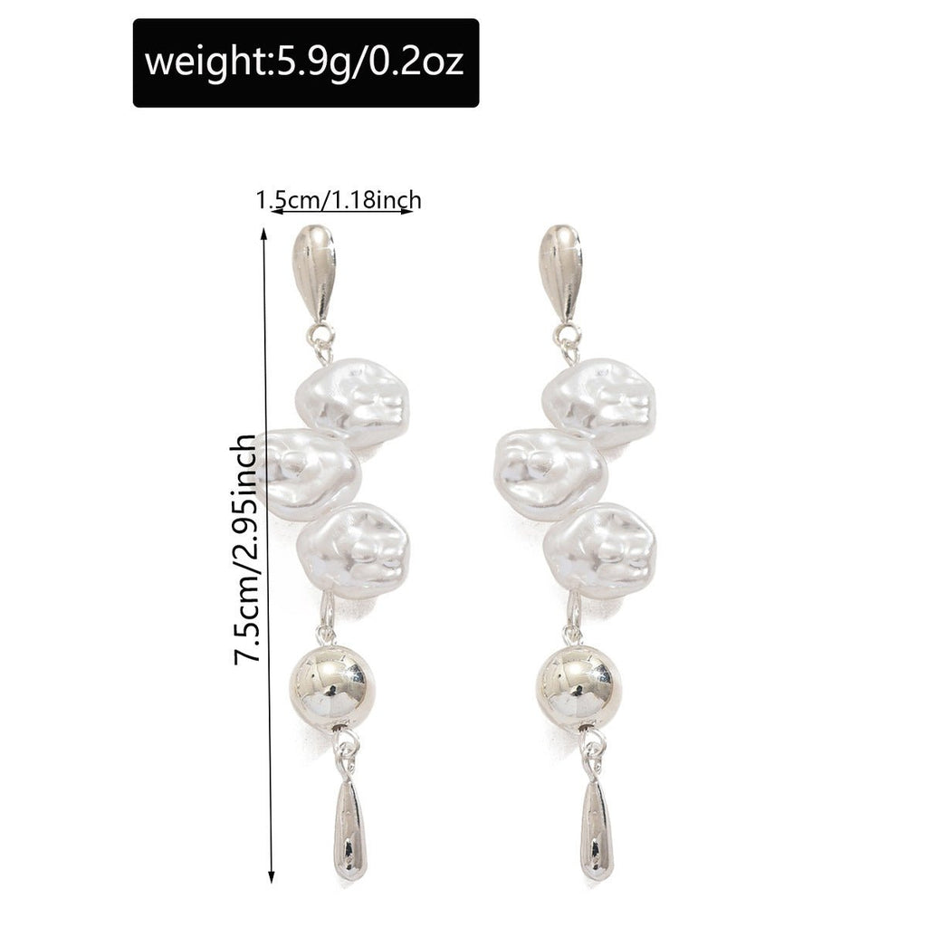 Mariam's Collection Artistic Asymmetric Pearl Drop Earrings (MAC325) — lifestyle worn / used context