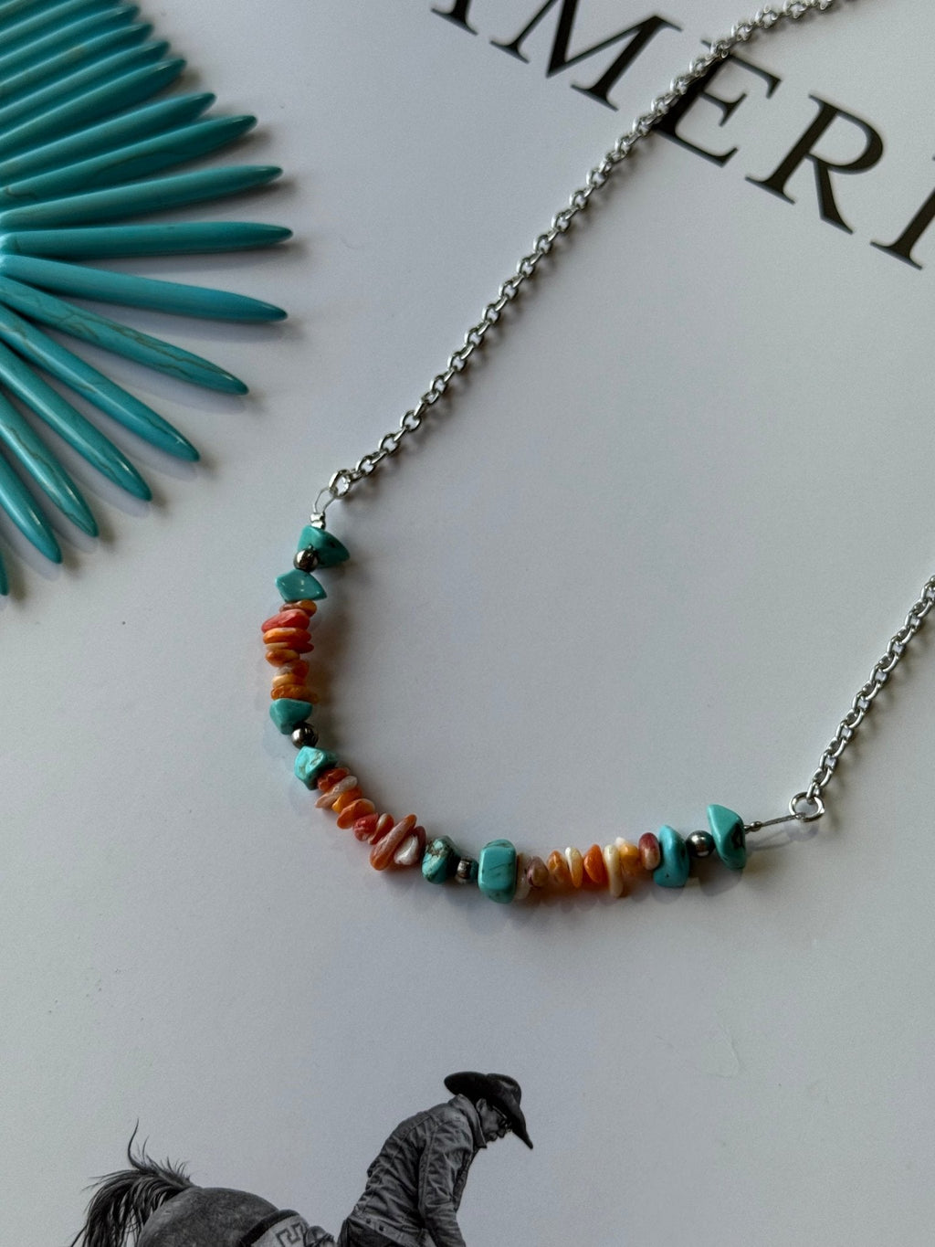 Wild Junkie Authentic Spiny Oyster Chip Bead Necklace — Wild Junkie branding close-up