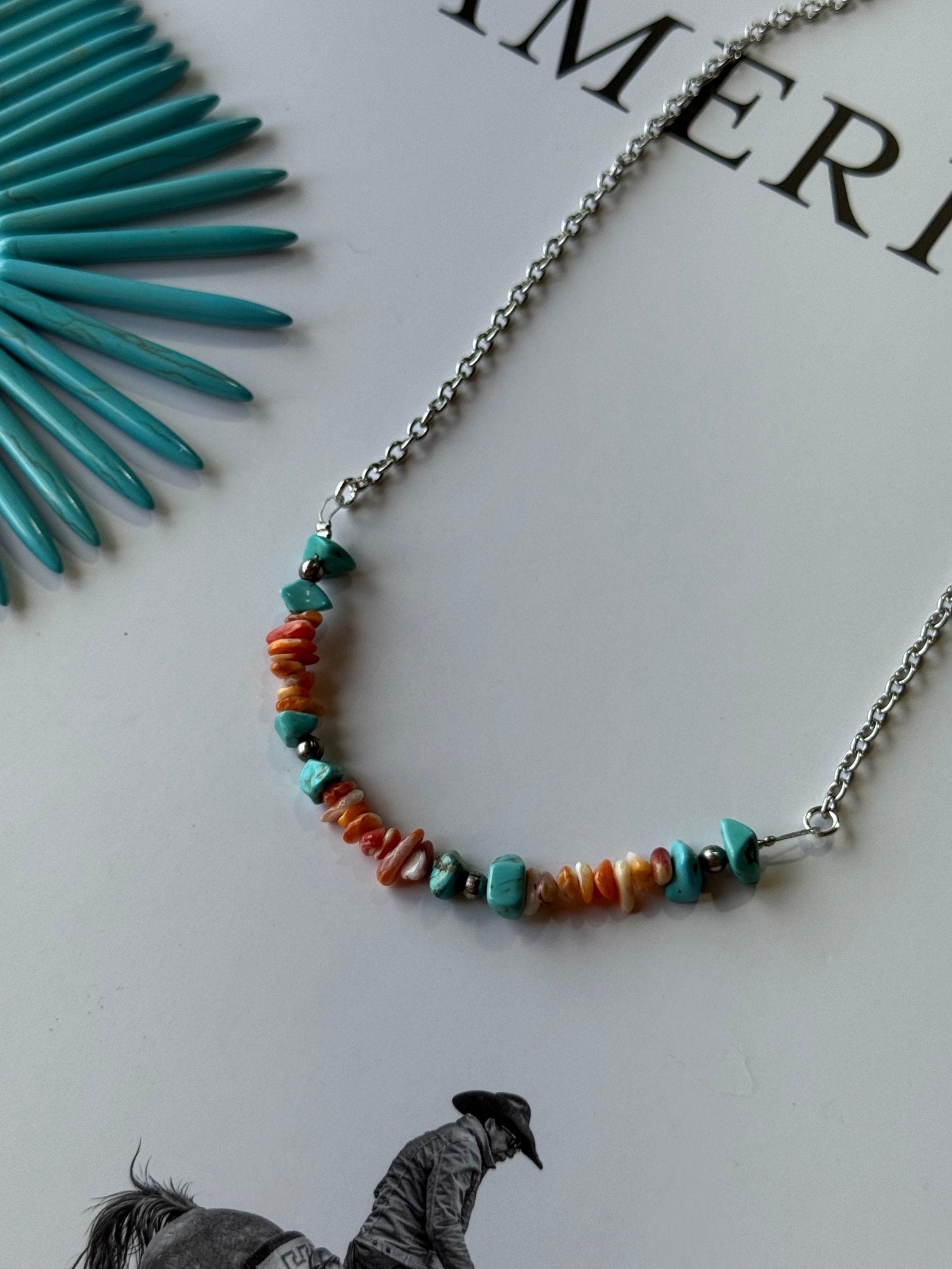 Wild Junkie Authentic Spiny Oyster Chip Bead Necklace — Wild Junkie branding close-up