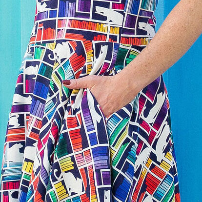 Princess Awesome & Boy Wonder Adult "Check Meowt" Rainbow Books & Cats Super Twirler Dress with Pockets — lifestyle worn / used context