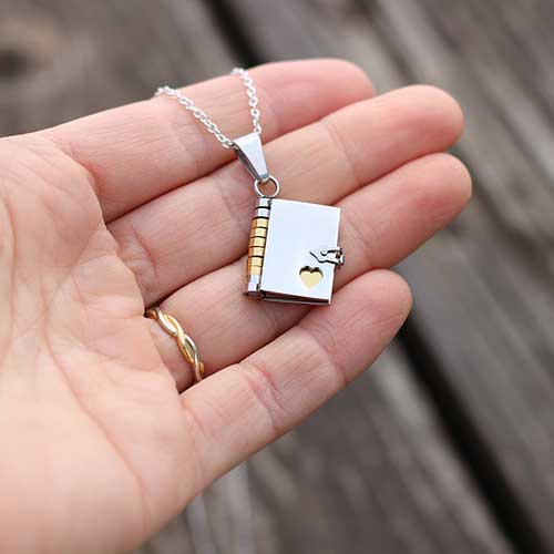 Princess Awesome & Boy Wonder Book with Pages Necklace — Princess Awesome & Boy Wonder branding close-up