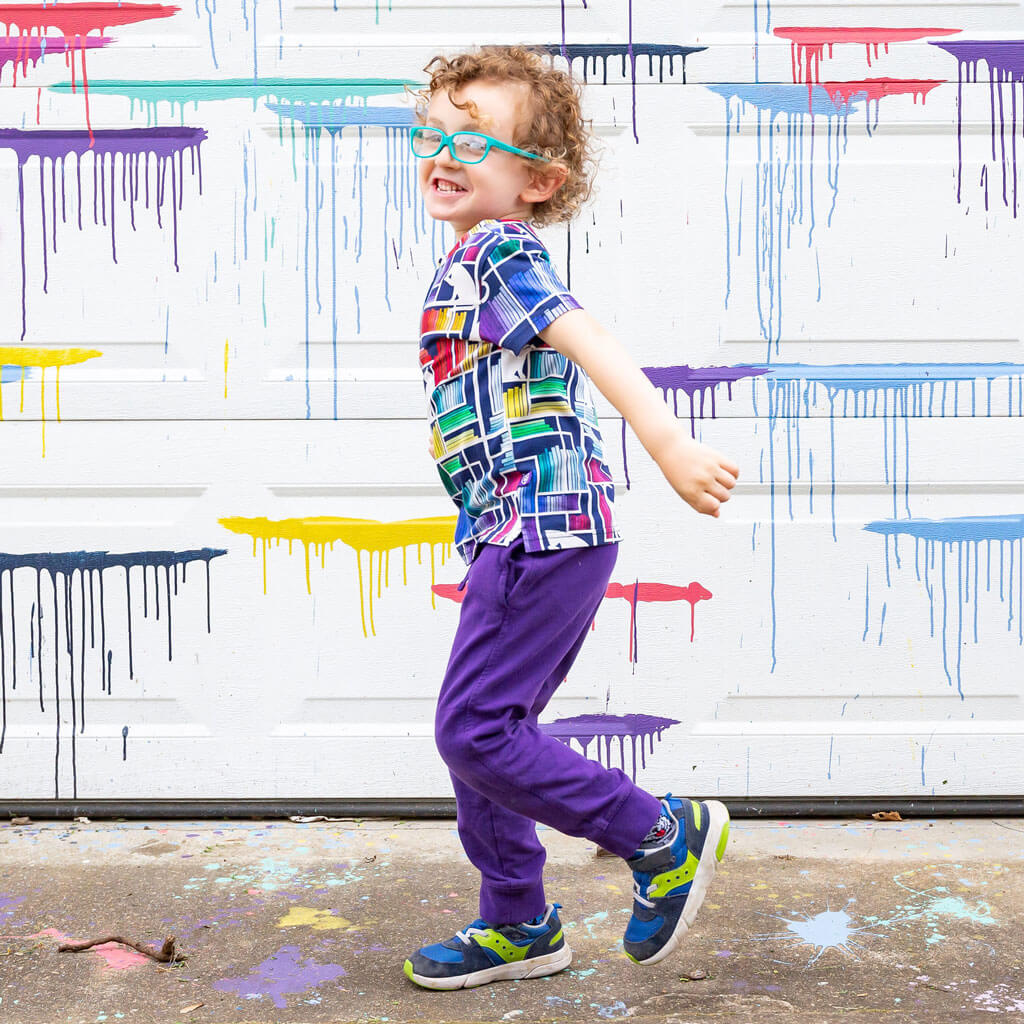 Princess Awesome & Boy Wonder "Check Meowt" Rainbow Books & Cats Henley Short Sleeve Tee — lifestyle worn / used context