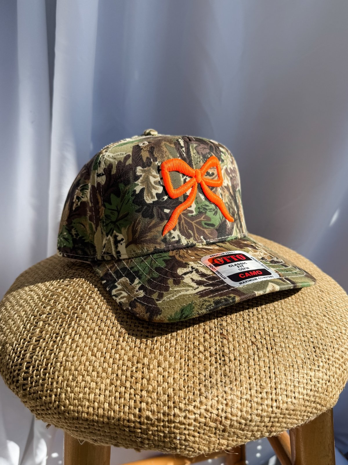 Coco & Rho Bow Camo- Trucker Hat Bright Orange — lifestyle context