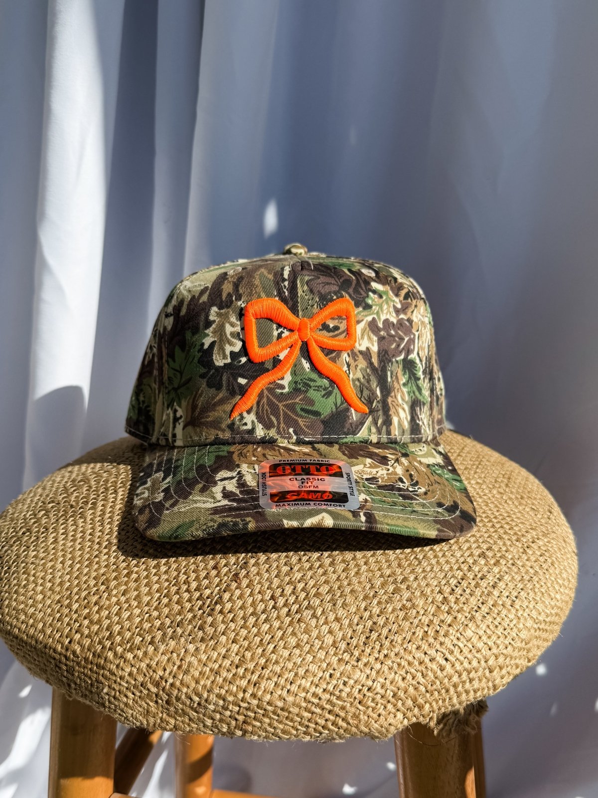 Coco & Rho Bow Camo- Trucker Hat Bright Orange — detail close-up
