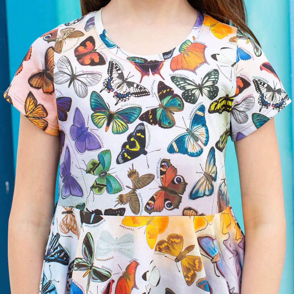 Princess Awesome & Boy Wonder Butterfly Evolution Super Twirler Dress with Pockets — Princess Awesome & Boy Wonder branding close-up