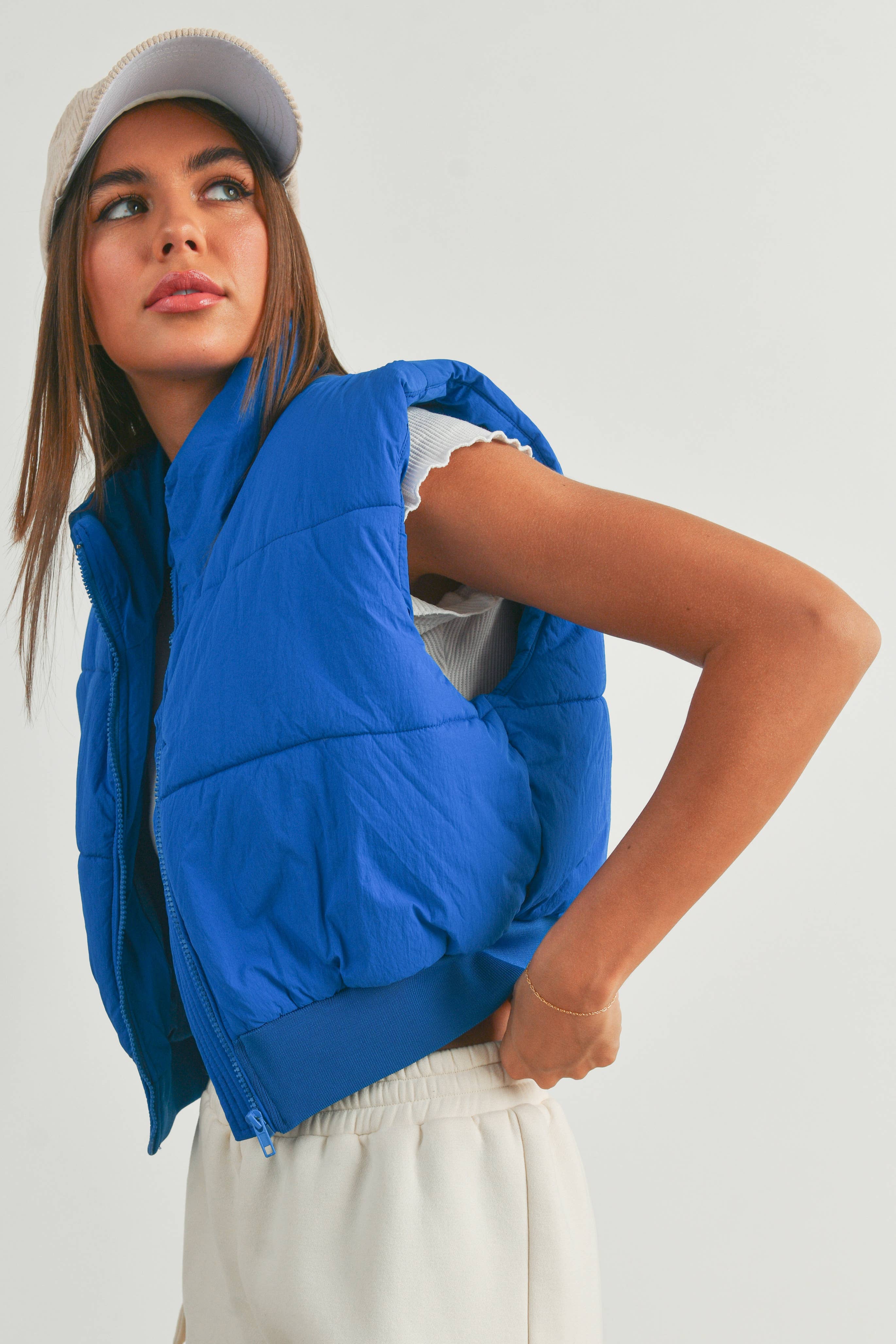 Pretty Little Patriot Pretty Little Patriot Royal Blue Crop Puffer Vest — Pretty Little Patriot branding close-up