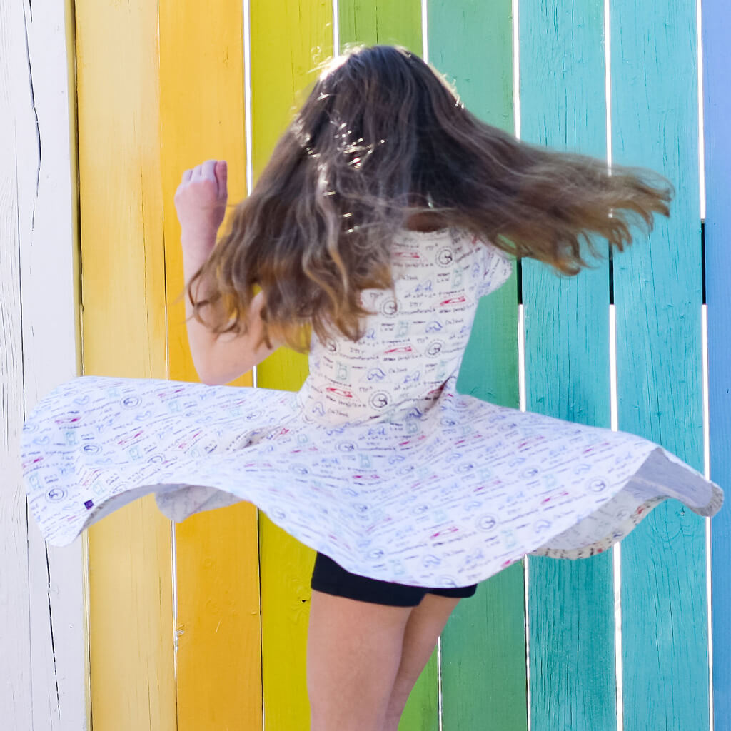 Princess Awesome & Boy Wonder "Scratch Paper" Geometry Cats Super Twirler Dress with Pockets — Princess Awesome & Boy Wonder branding close-up