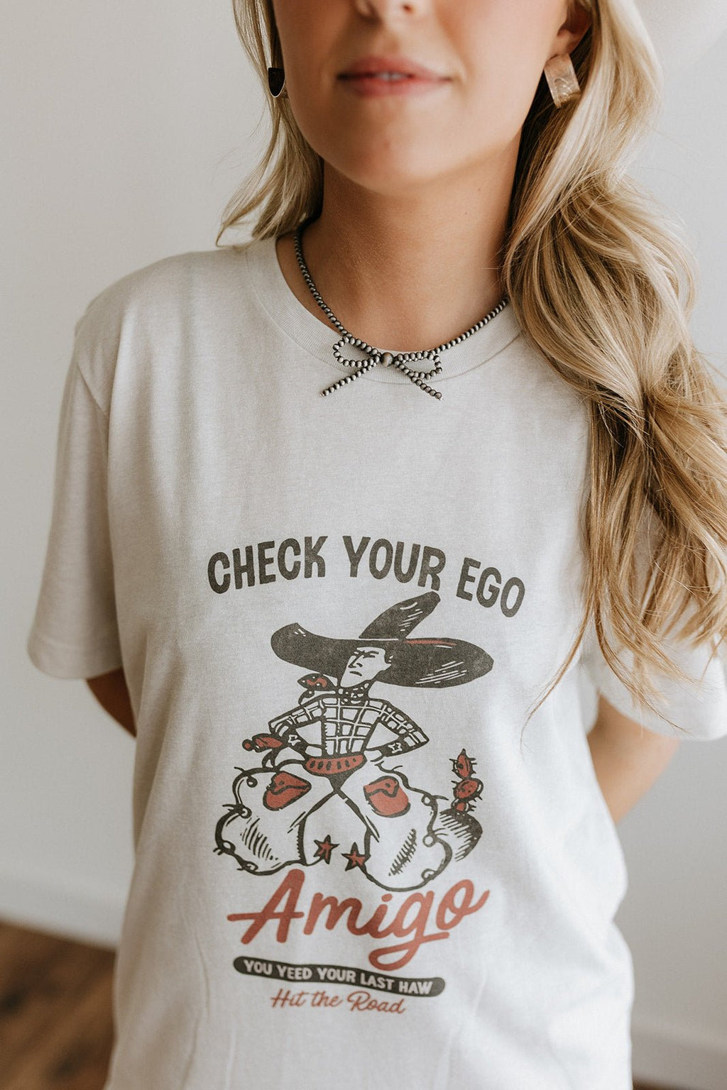 Wild Junkie Check Your Ego Amigo Cowboy Graphic Tee — detail close-up