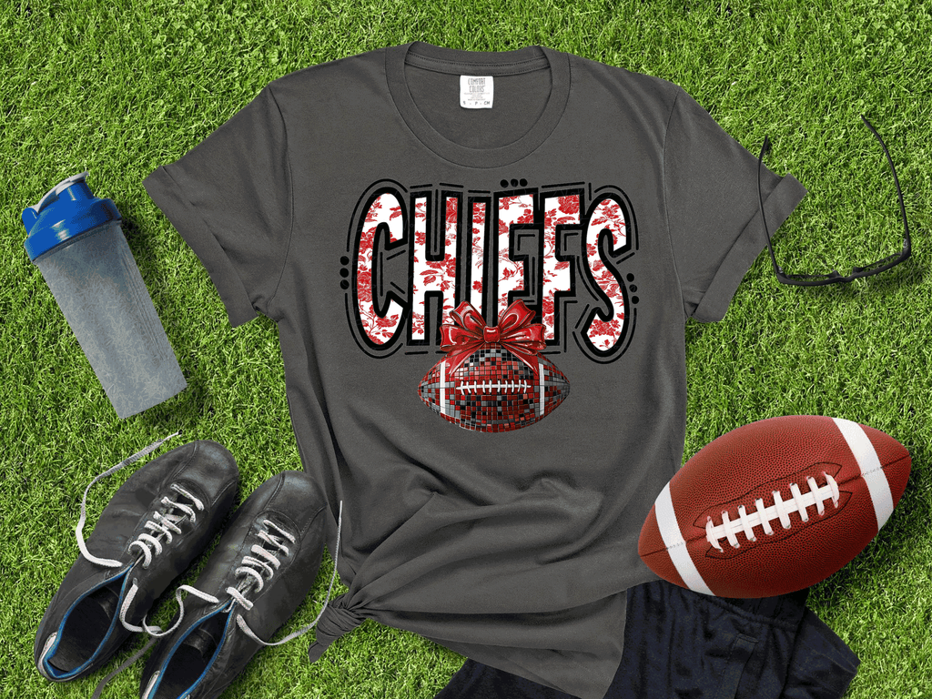 A Blessed Texas Mess Boutique Kansas City Football Metallic shirt, Chiefs Faux Glitter Football Kansas Toile… — lifestyle worn / used context