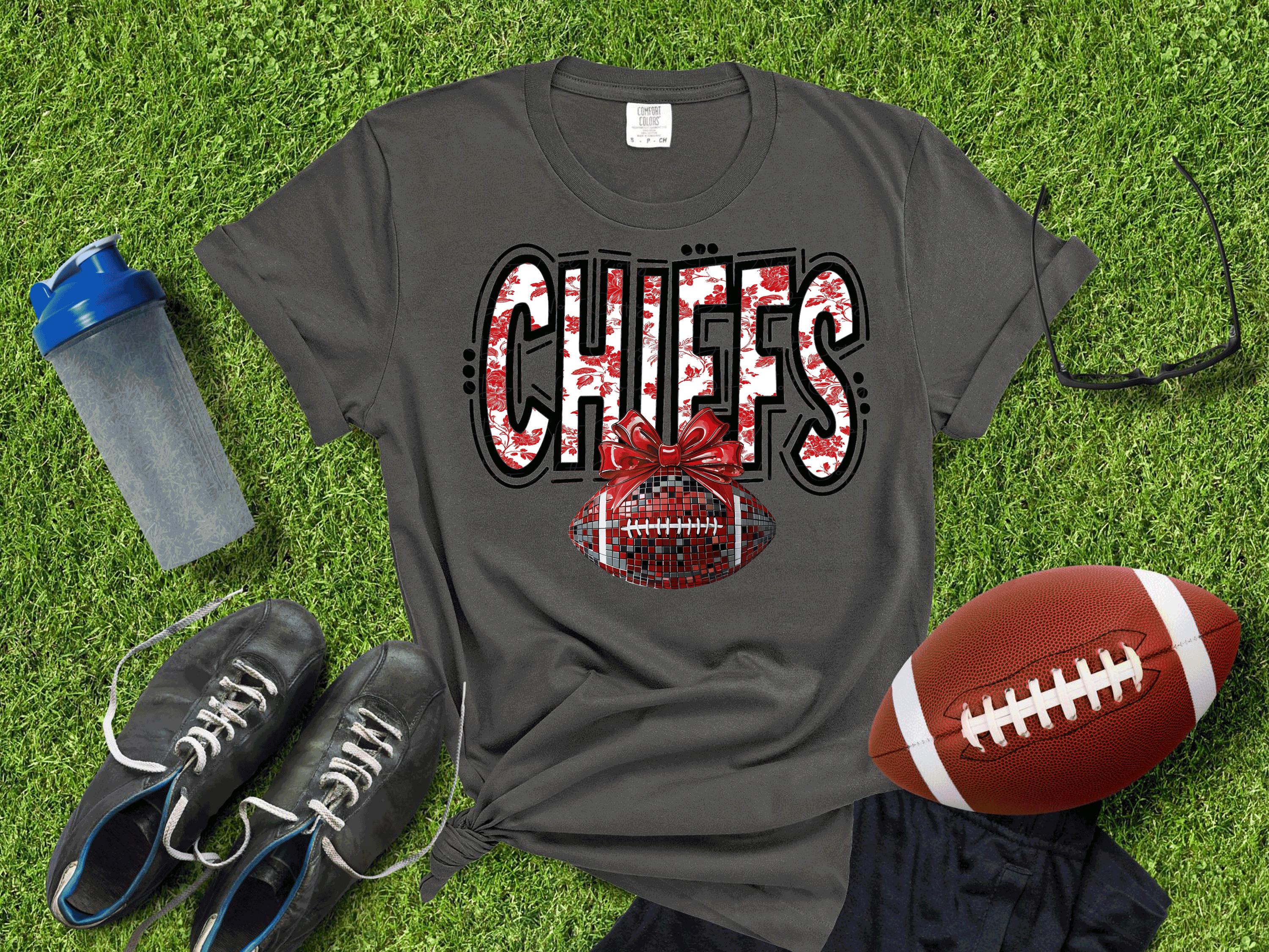 A Blessed Texas Mess Boutique Kansas City Football Metallic shirt, Chiefs Faux Glitter Football Kansas Toile… — lifestyle worn / used context