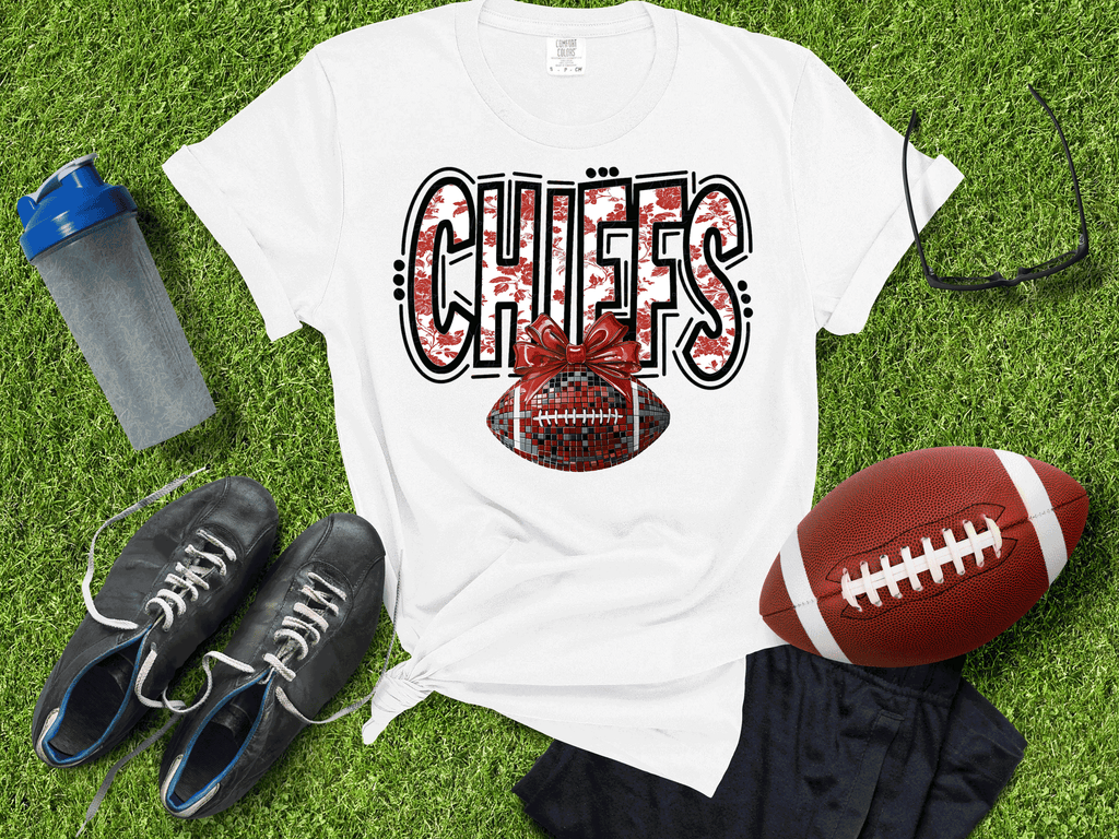 A Blessed Texas Mess Boutique Kansas City Football Metallic shirt, Chiefs Faux Glitter Football Kansas Toile… — main product shot