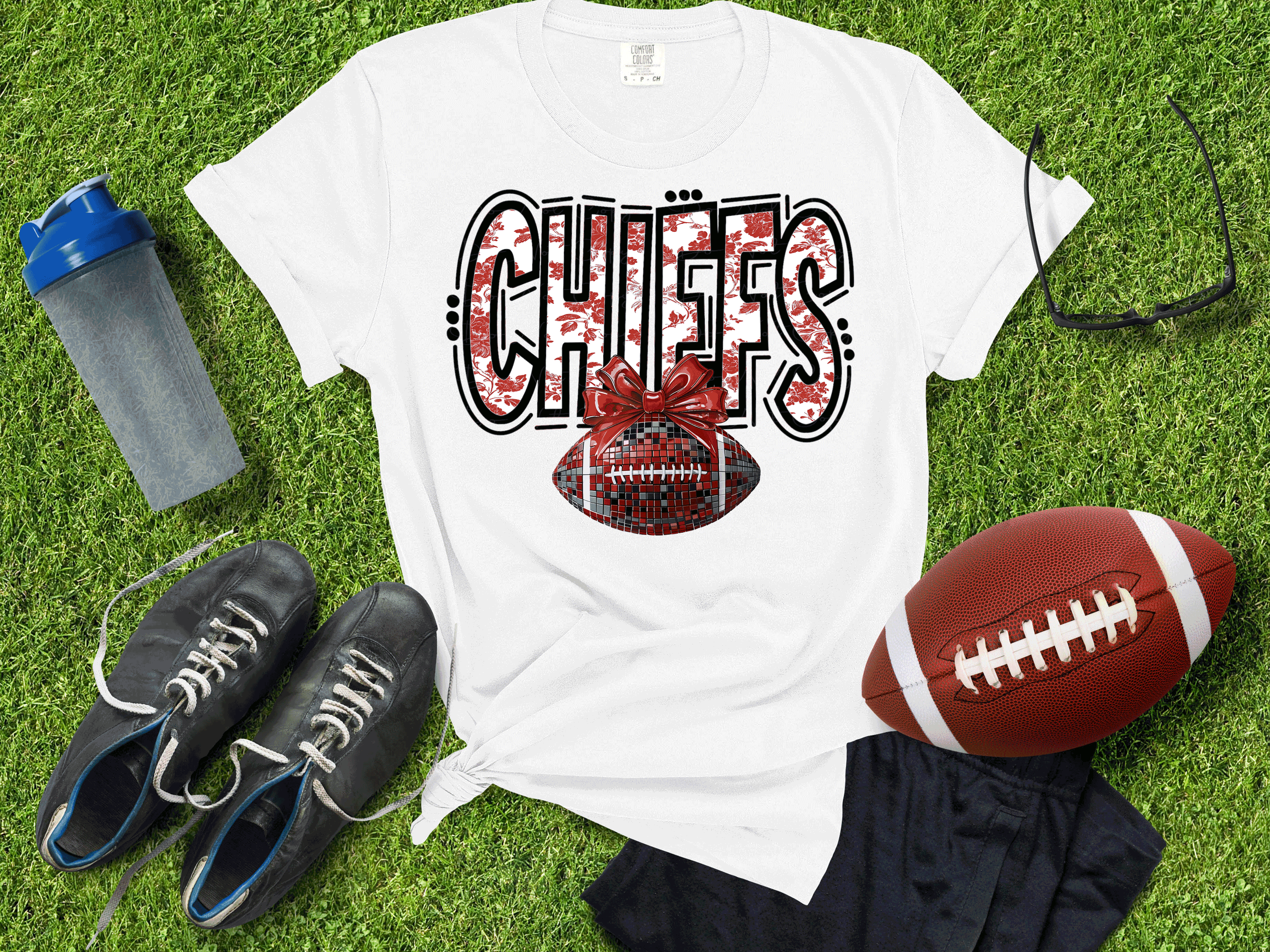 A Blessed Texas Mess Boutique Kansas City Football Metallic shirt, Chiefs Faux Glitter Football Kansas Toile… — main product shot