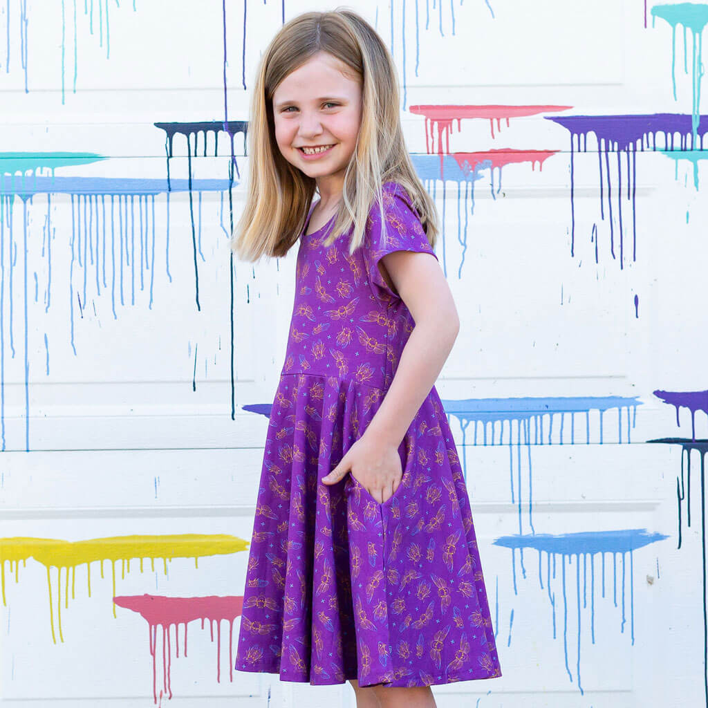 Princess Awesome & Boy Wonder "Emergence" Cicadas Super Twirler Dress with Pockets — Princess Awesome & Boy Wonder branding close-up