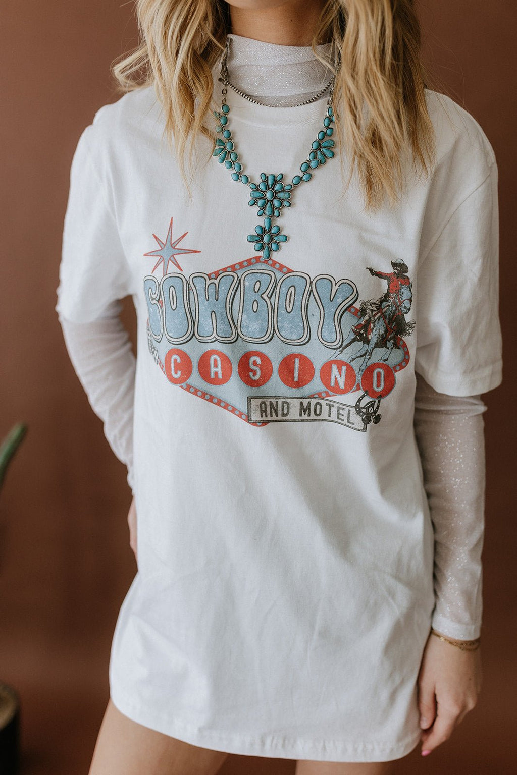 Wild Junkie Cowboy Casino Motel Graphic Tee — detail close-up