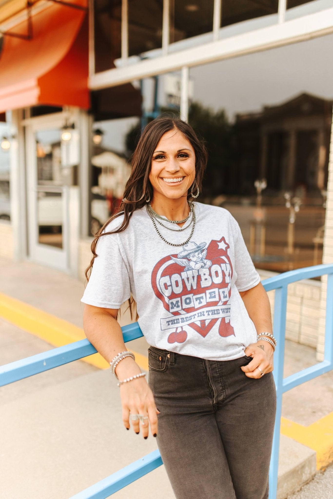 Wild Junkie Cowboy Motel Raw Cut V-neck Graphic Tee — lifestyle context