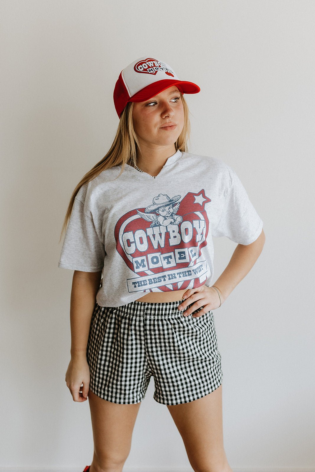 Wild Junkie Cowboy Motel Raw Cut V-neck Graphic Tee — main product shot