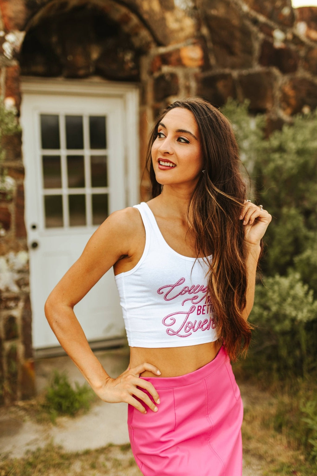 Wild Junkie Cowgirls Make Better Lovers Cropped Tank Top — Wild Junkie branding close-up
