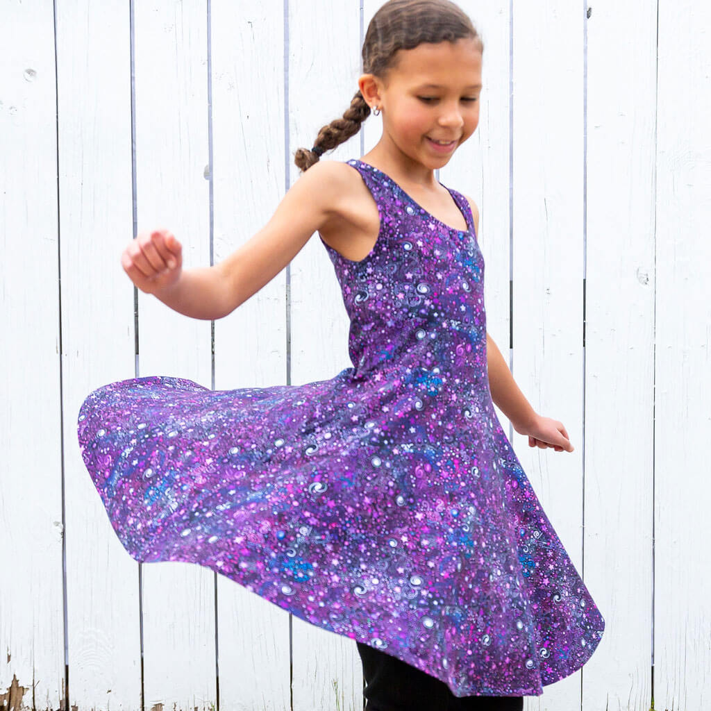 Princess Awesome & Boy Wonder Deep Field Galaxies Sleeveless Play Dress with Pockets — Princess Awesome & Boy Wonder branding close-up
