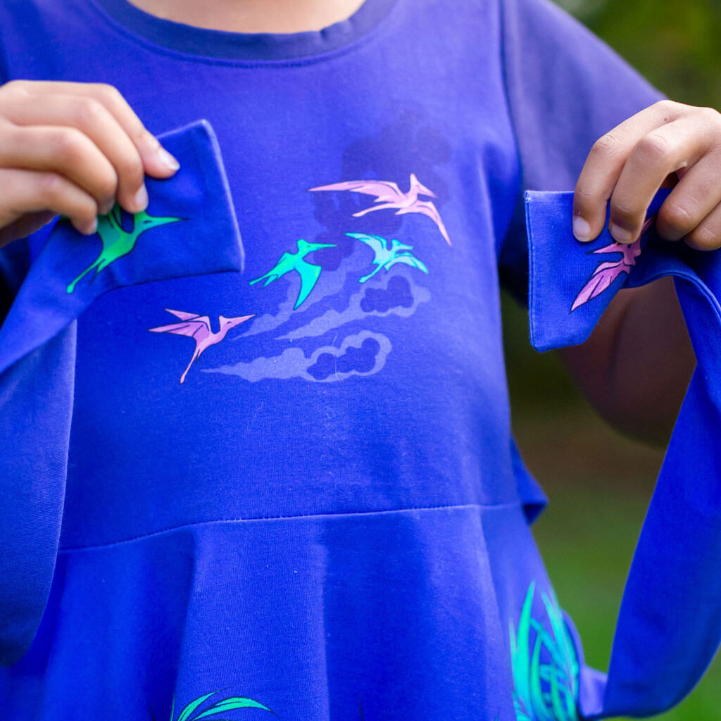 Princess Awesome & Boy Wonder Dinosaurs Busy Dress with Pockets — Princess Awesome & Boy Wonder branding close-up